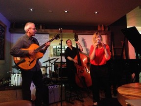 Ottawa guitarist Roddy Ellias and bassist John Geggie jam with vocalist Sofie Norling of Sweden at the TD Ottawa Jazz Festival's jam session.