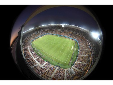 In this photo taken with a fisheye lens the teams run over the pitch during the group D World Cup soccer match between England and Italy at the Arena da Amazonia in Manaus, Brazil, Saturday, June 14, 2014.