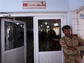 A member of the Kurdish security forces stands guard at the entrance of the emergency ward of a hospital in Arabil, the capital of the autonomous Kurdish region of northern Iraq, where fellow Peshmerga fighters wounded in clashes with jihadists from the Islamic State of Iraq and the Levant (ISIL) in Kirkuk were undergoing treatment on June 18, 2014. The rapid shift to Kurdish control in Iraq's ethnically mixed oil city of Kirkuk is a step toward a long-held dream for Kurds but has sparked fears among other groups.