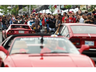 Italian made cars make their way along Preston St. in Ottawa's Little Italy, during Italian Festival on Saturday, June 14, 2014.