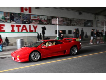 Italian made cars make their way along Preston St. in Ottawa's Little Italy, during Italian Festival on Saturday, June 14, 2014.