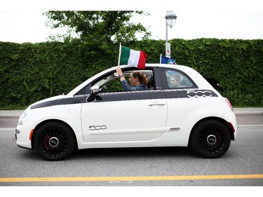 Italian made cars make their way along Preston St. in Ottawa's Little Italy, during Italian Festival on Saturday, June 14, 2014.