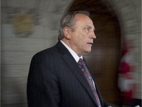 Government whip John Duncan, among 21 Conservative MPs from B.C.,  walks in the foyer of the House of Commons on Wednesday, June 11, 2014.