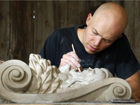 John-Philippe Smith models a clay Mascarov. The ancient trade of stonemasonry is making a revival on Parliament Hill, and Smith and Danny Barber (founders of Smith and Barber stonemasons in Ottawa) are two of the mason/sculptors recreating the stone carvings there.