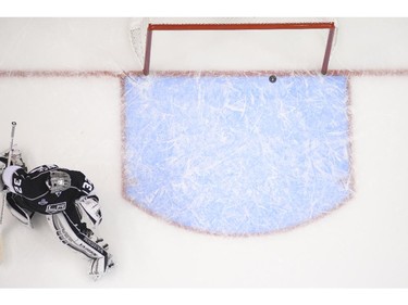 Los Angeles Kings goalie Jonathan Quick looks on as the puck enters the goal, shot by New York Rangers center Brian Boyle, during the second period in Game 5 of the NHL hockey Stanley Cup finals, Friday, June 13, 2014, in {city.