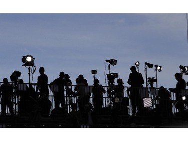 Journalists attend the D-Day commemorations at the Ouistreham beach, France, Friday, June 6, 2014.  Watched by the media, world leaders and veterans gathered by the beaches of Normandy, northern France, on Friday to mark the 70th anniversary of the World War II D-Day landings.