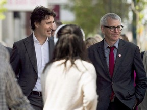 Federal Liberal leader Justin Trudeau, left, and Trinity-Spadina candidate Adam Vaughan, campaign in Toronto on May 22, 2014.