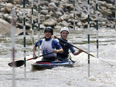 Kate Poulier and James O'Donoghue-Hayes race in Canoe Double (C2) at the first Ontario canoe slalom race of the year, at the Pumphouse downtown Ottawa on June 29, 2014. Many of these paddlers have hopes of representing Ontario at the PanAm games in 2015, while others are local recreational paddlers racing for the first time.