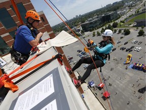 Kathleen Frangione was one of about 80 who raised at least $1,500 for the Make a Wish Foundation and won the prize of rappelling from the roof of the Courtyard by Marriott Hotel at the Rope for Hope event, the first to be held in Ottawa, on Saturday, June 28, 2014.