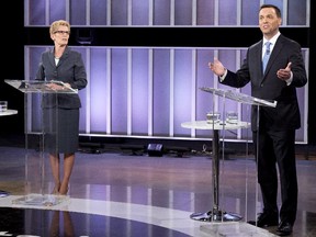 Ontario Premier Kathleen Wynne, left, and Ontario PC leader Tim Hudak take part in the live leaders debate at CBC during the Ontario election in Toronto on Tuesday, June 3, 2014.