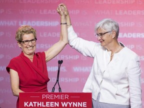 Ontario Liberal leader Kathleen Wynne celebrates with partner Jane Rounthwaite after winning the Ontario election in Toronto on Thursday June 12, 2014.