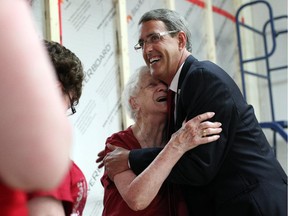 Liberal candidate for Glengarry-Prescott Russell Grant Crack shares a hug with family friend Gloria Ledger, 90, who made the trip up from Toronto to support him, at election headquarters on June 12, 2014 in Alexandria, Ontario. (Cole Burston/Ottawa Citizen)