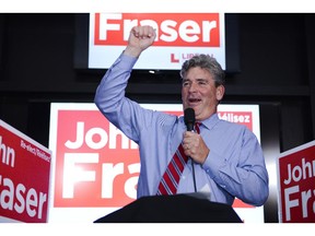 Liberal candidate for Ottawa South, John Fraser, celebrates the win after the result has been announced for the election at the Hometown Sports and Grill on Thursday, June 12, 2014. (James Park / Ottawa Citizen)