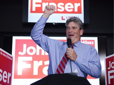 John Fraser, Liberal candidate for Ottawa South, celebrates the win after the result has been announced for the election at the Hometown Sports and Grill on Thursday, June 12, 2014.
