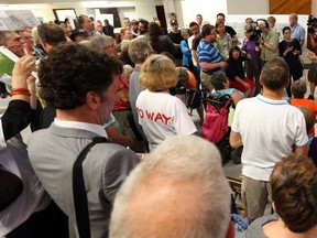 Many people attended the information session about the detour off the Transitway from Tunney's Pasture to downtown onto Scott and Albert streets at Tom Brown arena in Ottawa, June 16, 2014.