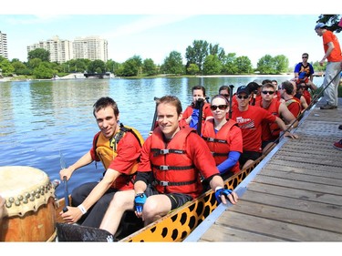 Members of Bureaucrats on Board: Diplomatic Dragons prepare to race at the Dragon Boat Festival at Mooney's Bay on Saturday.