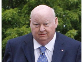 File photo: Sen. Mike Duffy makes his way to the Senate on Parliament Hill, Tuesday, May 28, 2013 in Ottawa.