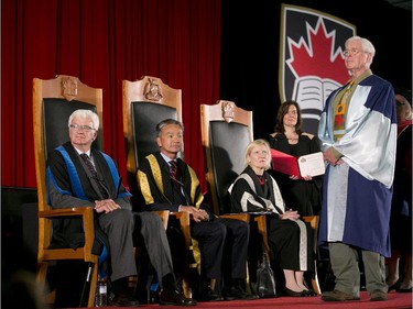 Musician, activist and Ottawa native, Bruce Cockburn receives his honorary doctorate from Carleton University on Thursday, June 12, 2014.