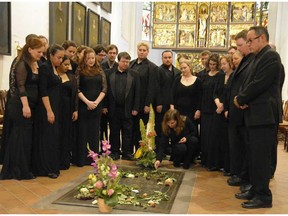 The Ottawa Bach Choir stands by J.S. Bach's tomb inside the Thomaskirche in Leipzig, Germany.