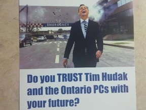 A flyer depicting Ont. PC leader Tim Hudak laughing as he walks away from an exploding hospital is shown. THE CANADIAN PRESS/HO