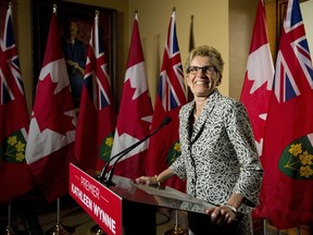Ontario Premier Kathleen Wynne speaks to the media at Queen's Park in Toronto on Friday, the day after winning a majority government.