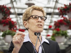 Ontario Liberal Leader Kathleen Wynne addresses the media following an announcement regarding post secondary tuition grants at the Niagara College greenhouse during a campaign stop at the campus in Niagara-on-the-Lake, Ont., Thursday, May 29, 2014.