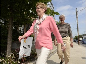 Premier Kathleen Wynne on her way to vote earlier Thursday.