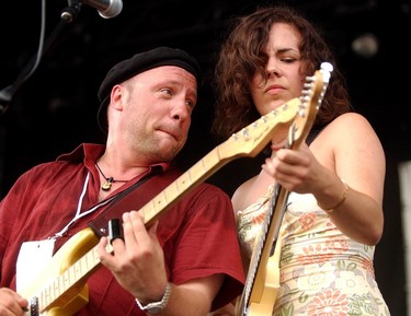 Tony D, left, shown with Roxanne Potvin, has become an annual tradition at Bluesfest, after saving the day once in the early years. (Photo by Kier Gilmour, Ottawa Citizen)