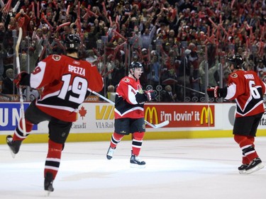 Jason Spezza, Daniel Alfredsson and Wade Redden of the Ottawa Senators celebrater Ottawa's first goal against the Buffalo Sabres during first period action of the fifth game of the Eastern Conference semifinals held at Scotiabank Place in Ottawa, Saturday, May 13, 2006.