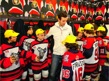 Jason Spezza of the Ottawa Senators is surrounded by the Mississauga Rebels at the Bell Sensplex in Ottawa, Thursday, December 29, 2005.