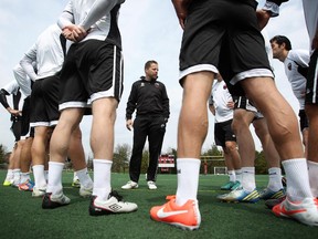 Ottawa Fury FC Head Coach Marc Dos Santos speaks with his team during a practice on Friday, May 9, 2014.