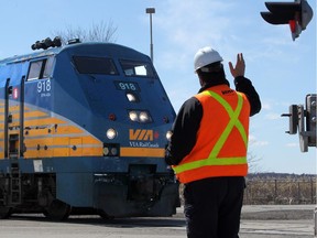 A Via train was halted Saturday after a man was spotted running on the tracks.