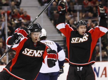 Jason Spezza (L) of the Ottawa Senators celebrates his goal with Dany Heatley against the Atlanta Thrashers during first period action held at Scotiabank Place in Ottawa, December 03, 2008.