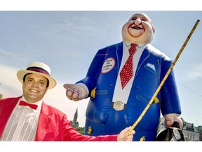 Gregory Thomas, Federal Director of the Canadian Taxpayers Federation, raised an inflatable Mike Duffy on Victoria Island in Ottawa in July, 2013, calling for a national referendum on abolishing the Senate. Chris Mikula, Ottawa Citizen