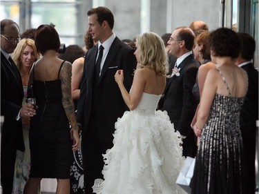 Ottawa senators star Jason Spezza and his bride Jennifer Snell greet guests arriving at their wedding reception, held inside the National Gallery of Canada in Ottawa on July 25, 2009.