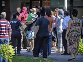 Parents pick up their children after Ottawa Police locked down Charles Hulse Public School on Alta Vista dr after hearing reports that a man with a gun was spotted nearby.