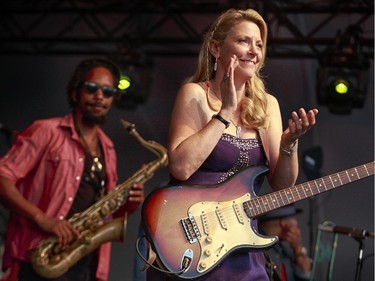Susan Tedeschi, right, and Kebbi Williams of the Tedeschi Trucks band perform on the main stage at the 2014 Ottawa Jazz Festival.