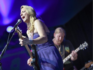 Susan Tedeschi, left, and Derek Trucks of the Tedeschi Trucks band perform on the main stage at the 2014 Ottawa Jazz Festival.