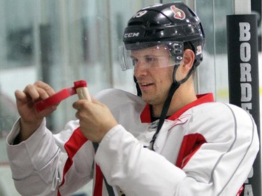 Senators forward Jason Spezza tapes a stick at the Bell Sensplex this morning in Kanata (Ottawa) on Tuesday, September 11, 2012. Local NHLers -- and NHL wannabees -- are practicing and scrimmaging prior to the opening of training camps on Sept. 15. That is, if the league doesn't lock them out. It doesn't look like a new CBA will be in place anytime soon.