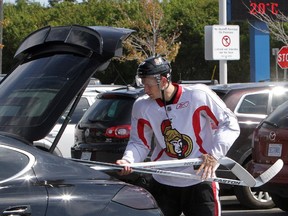 Senators forward Jason Spezza throws his hockey sticks into his Porsche after a practice/scrimmage at the Bell Sensplex this morning in Kanata (Ottawa) on Tuesday, September 11, 2012.