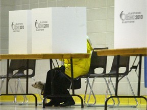 A voter casts her ballot in an Ottawa municipal election.