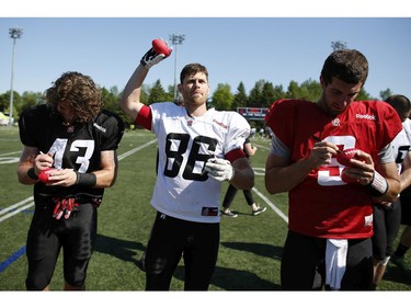 Ottawa RedBlacks #86 Simon Le Marquand signed and handed out toy footballs to fans after an intrasquad game at the Mont-Bleu Sports Complex in Gatineau on Saturday, June 7, 2014.