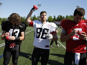 Ottawa RedBlacks, No. 86, Simon Le Marquand signed and handed out toy footballs to fans after an intrasquad game at the Mont-Bleu Sports Complex in Gatineau.