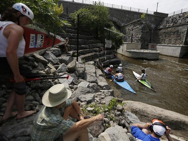 Paddlers gather at the start area at the first Ontario canoe slalom race of the year, at the Pumphouse downtown Ottawa on June 29, 2014. Many of these paddlers have hopes of representing Ontario at the PanAm games in 2015, while others are local recreational paddlers racing for the first time.