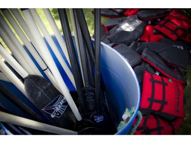 Paddles and life jackets sit near the water at the 21st Tim Hortons Ottawa Dragon Boat Festival which took place this past weekend at Mooney's Bay Park. (Ashley Fraser / Ottawa Citizen)