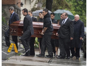 Pallbearers, including the Danny Volpi, second from right, carry the casket of Brandon Volpi into St. Anthony's Church in Ottawa for his funeral on Friday, June 13, 2014. Volpi, a student at St. Patrick's High School was killed in a stabbing during his prom night in downtown Ottawa. J
