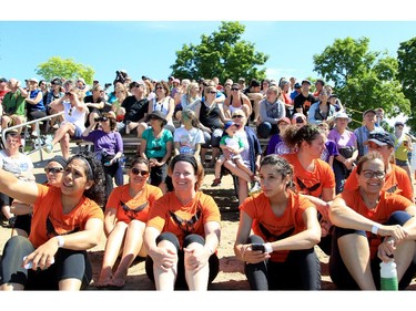 Participants and spectators take in the action at the Dragon Boat Festival at Mooney's Bay on Saturday.
