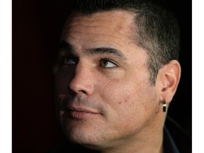 Suspended Sen. Patrick Brazeau speaks to the media after applying for membership to the parliamentary press gallery at the National Press Building in Ottawa on Monday, December 2, 2013.