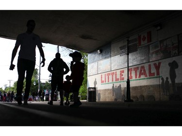 People walk through Little Italy on Saturday, June 14, 2014 at Allegro.