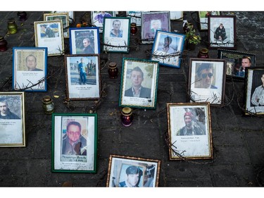 Photographs of anti-government protesters killed during the Euromaidan demonstrations are displayed at a makeshift memorial near Independence Square on June 7, 2014 in Kiev, Ukraine. Ukraine's new president, Petro Poroshenko, was inaugurated earlier Saturday after protesters ousted former president Viktor Yanukovych in February.